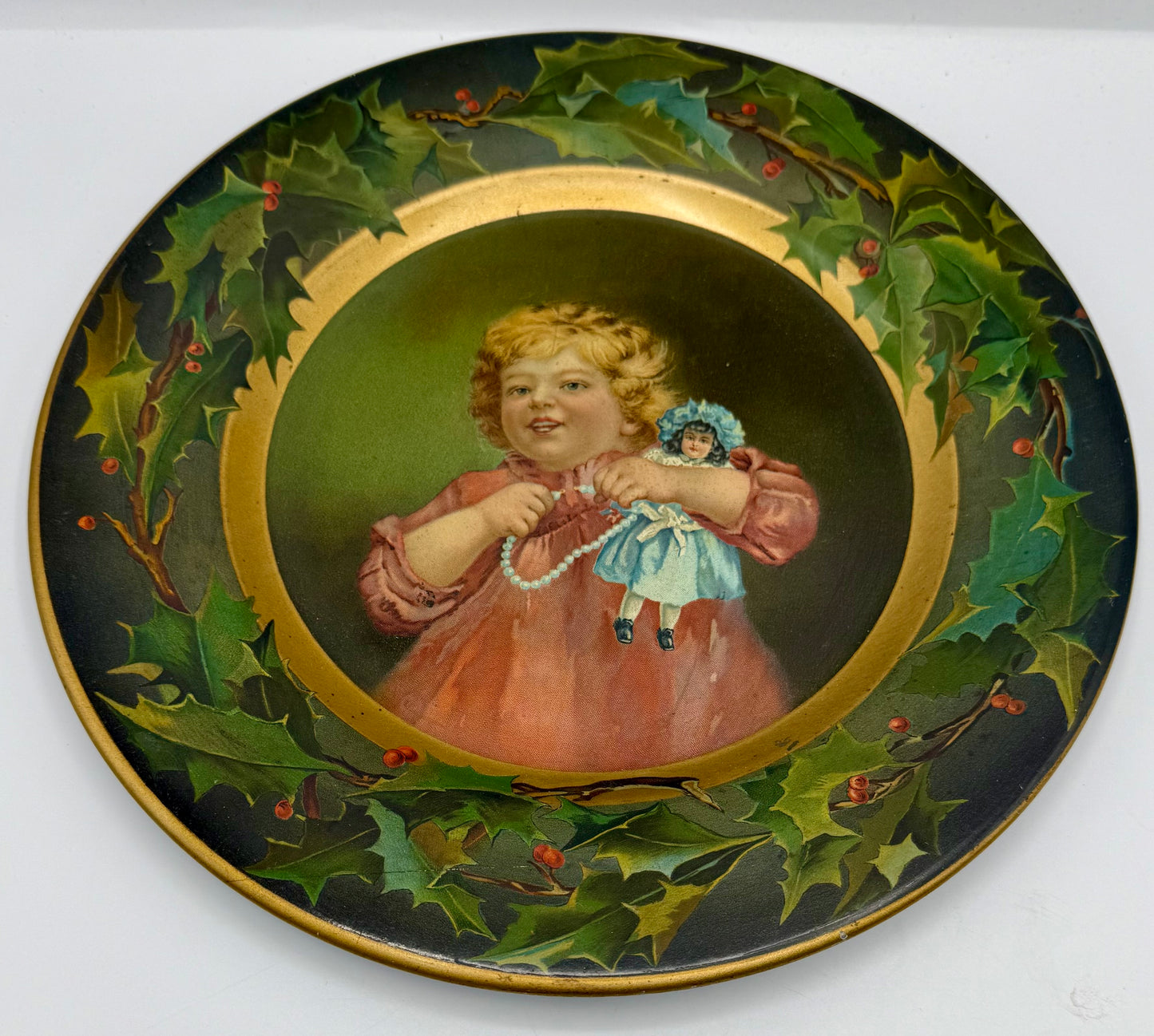 C.D. Kenny Tin Litho Christmas Holly Plate Girl with Doll and Pearls Advertising Premium for Coffee and Tea
