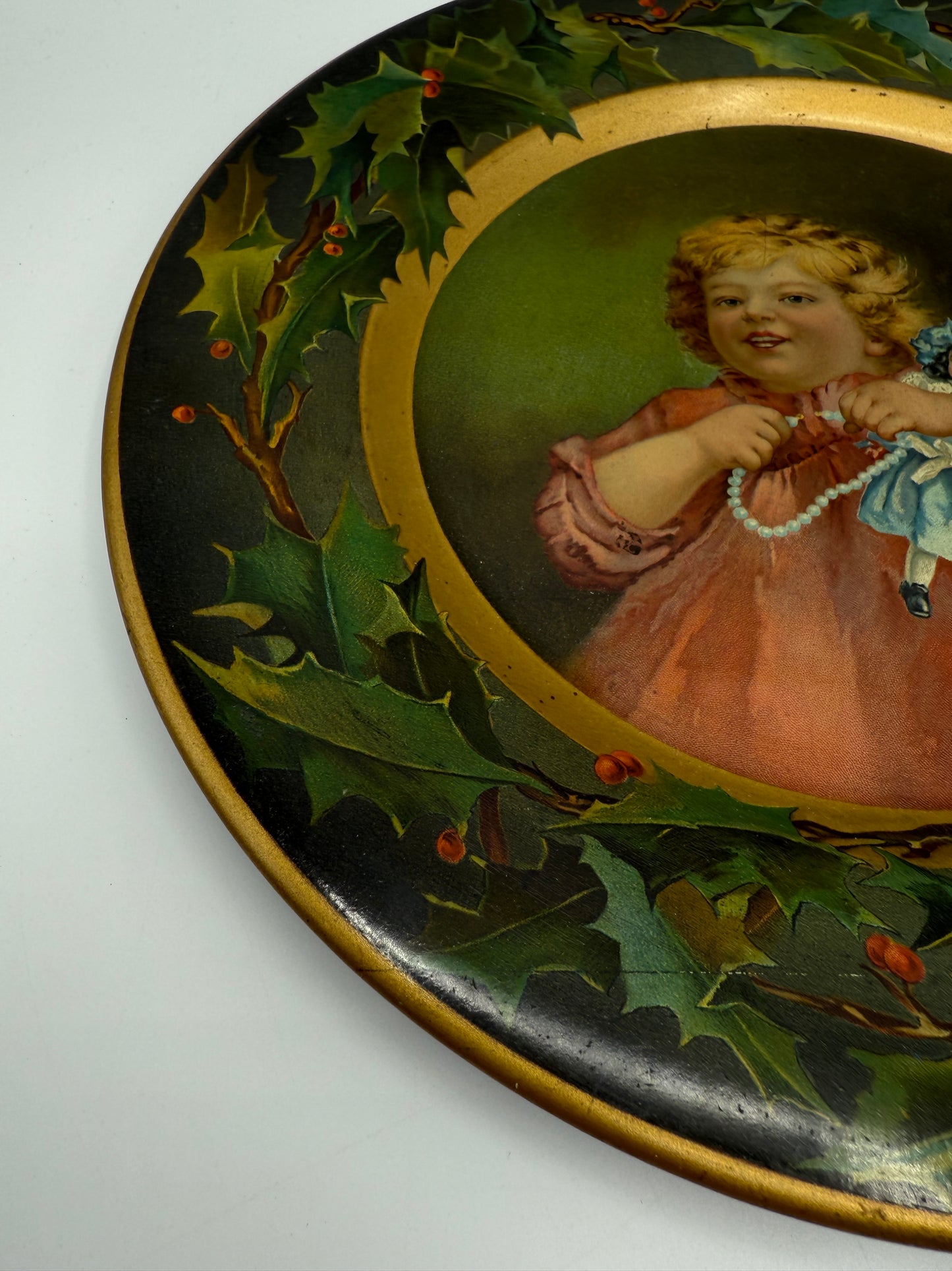 C.D. Kenny Tin Litho Christmas Holly Plate Girl with Doll and Pearls Advertising Premium for Coffee and Tea
