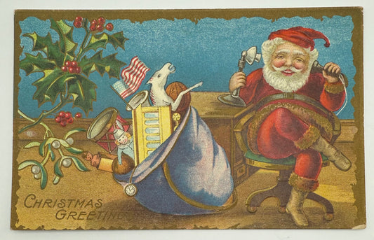 Unposted Santa Claus on the Telephone at Desk Embossed Patriotic Postcard with American Flag and Sack of Toys Holly Christmas
